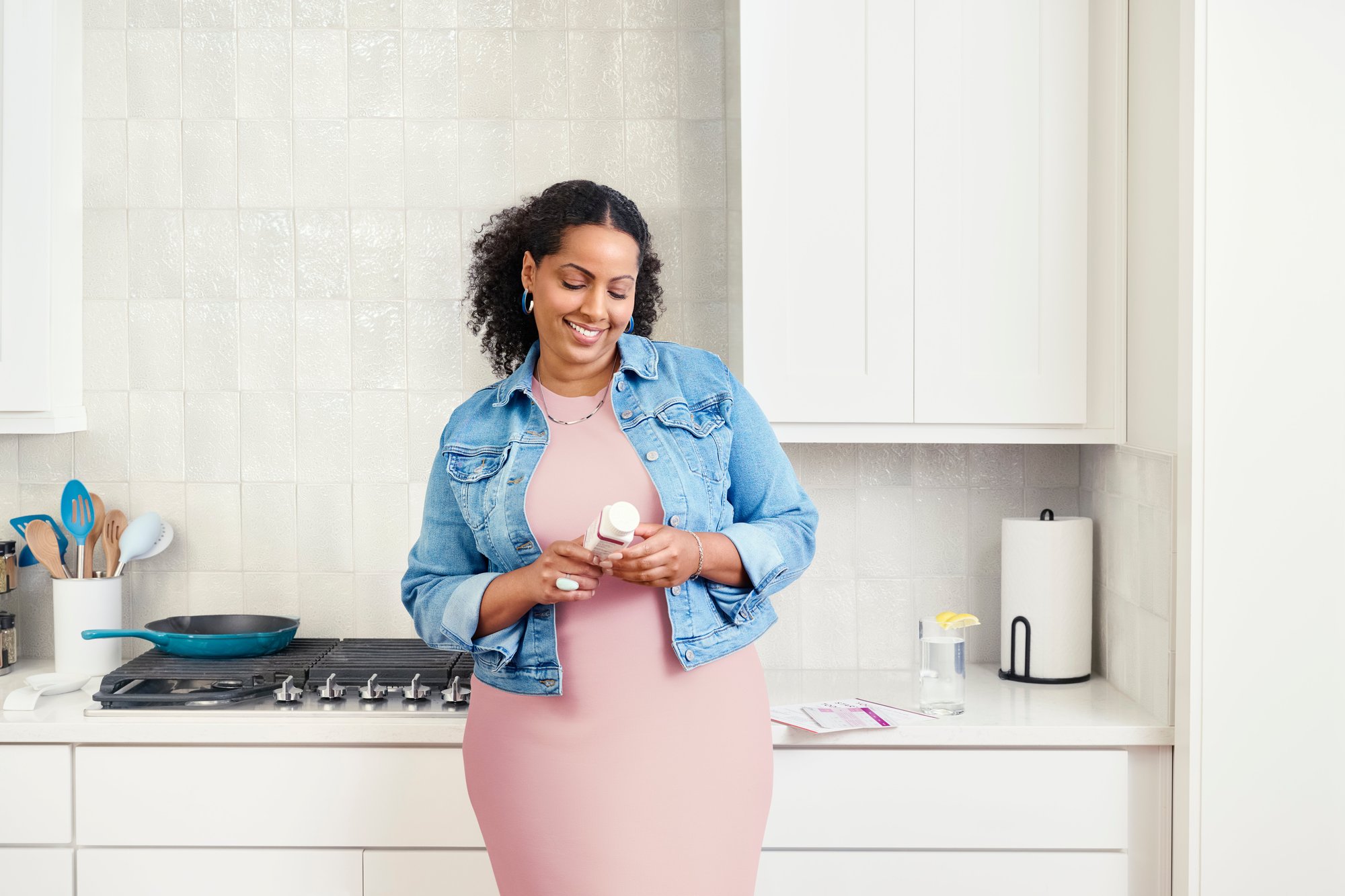 woman looking at contrave pill bottle